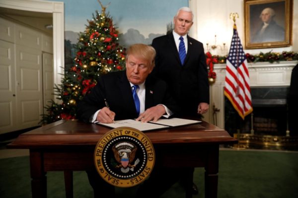 White House vows to help arm teachers and backs off raising age for buying guns