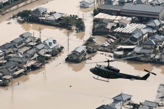 Rescuers race to find survivors after Japan floods kill at least 114