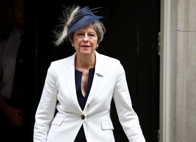 Britain’s May reasserts her authority after Brexit resignations