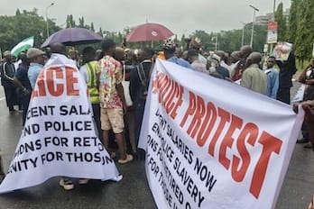 Retired Police Officers Drench in Rain to Demand Exit from “Exploitative” Pension Scheme